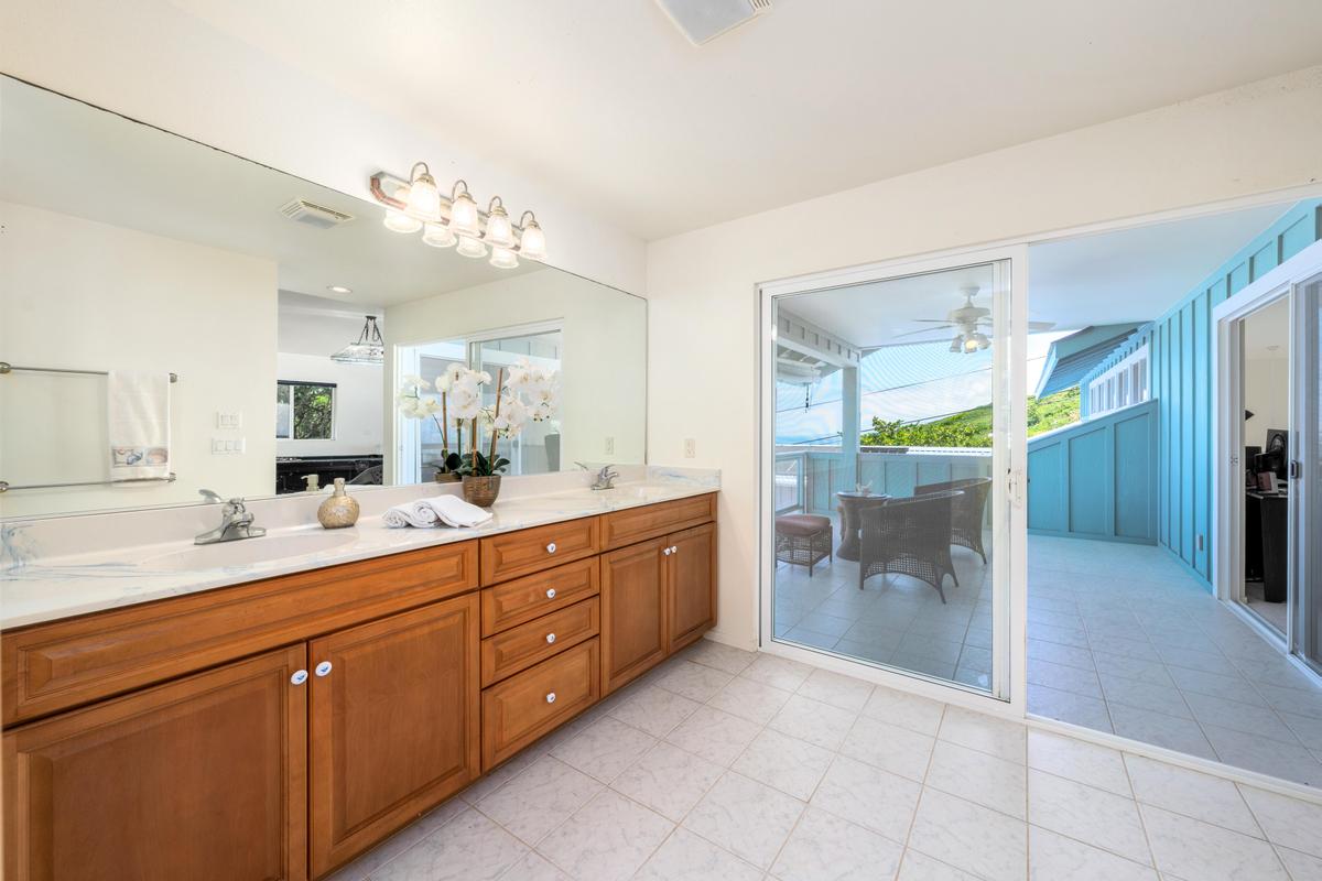 87-404 Kaohe Road Captain Cook, HI 96704 - Photo 16 of 25 a spacious bathroom with a granite countertop sink mirror and shower