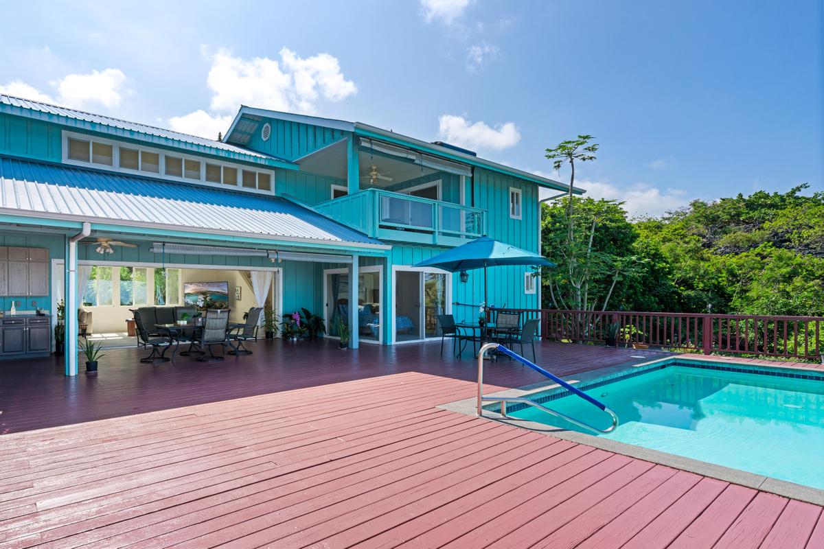 87-404 Kaohe Road Captain Cook, HI 96704 - Photo 3 of 25 a view of a house with a patio and a yard