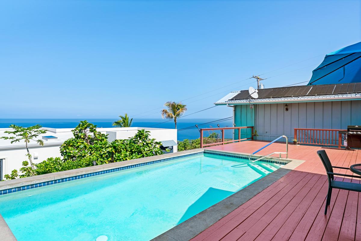 87-404 Kaohe Road Captain Cook, HI 96704 - Photo 4 of 25 a view of a chairs and table on the wooden roof deck