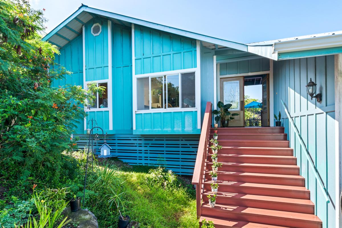 87-404 Kaohe Road Captain Cook, HI 96704 - Photo 9 of 25 a view of a house with a small yard