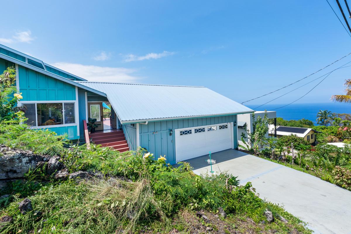 87-404 Kaohe Road Captain Cook, HI 96704 - Photo 10 of 25 a front view of a house with a yard