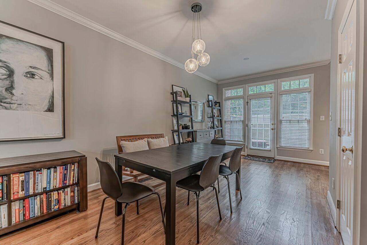 106 Hatfield Lane Raleigh, NC 27603 - Photo 7 of 29 a view of a dining room with furniture window and wooden floor