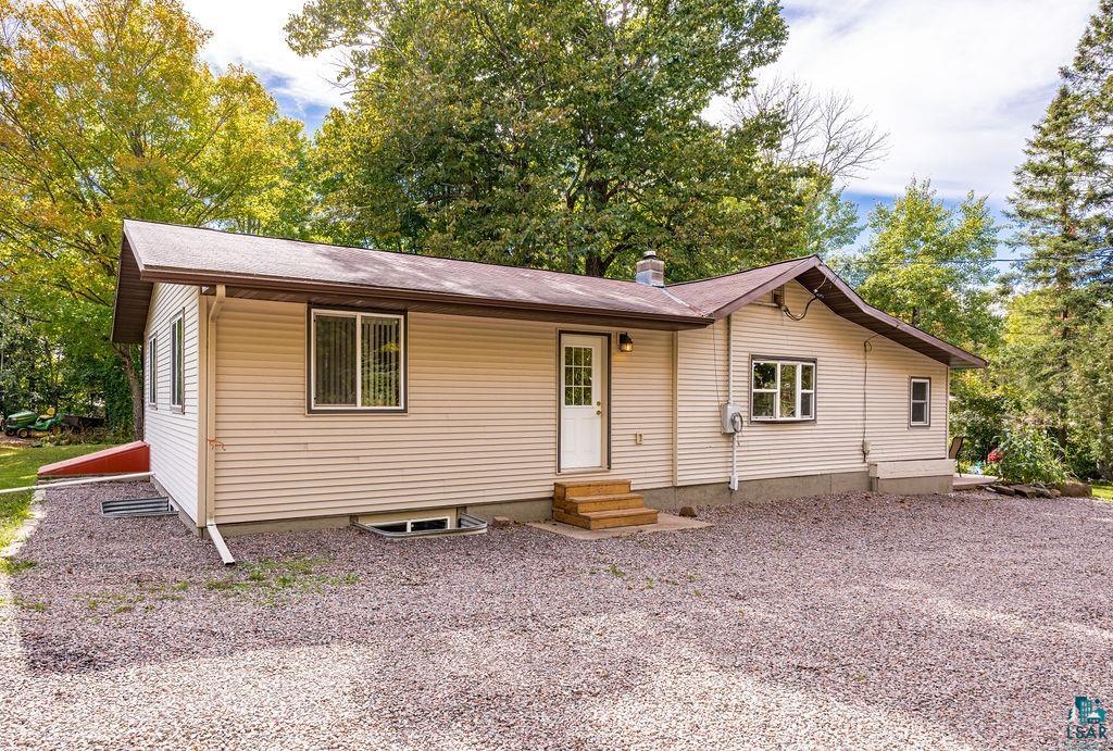 5466 Jean Duluth Road Duluth, MN 55803 - Photo 27 of 34 Exterior featuring horizontal siding, a gabled roofline, and a gravel driveway