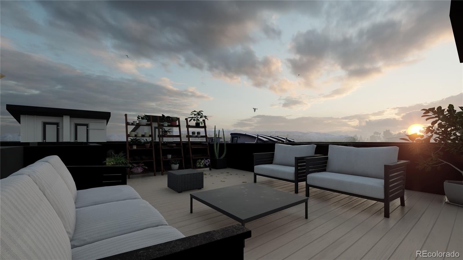 1275 Stuart Street Denver, CO 80204 - Photo 7 of 20 a roof deck with couches and potted plants with sky view