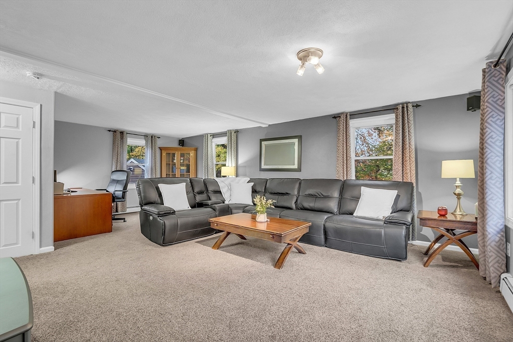 91 Chapin Road Hudson, MA 01749 - Photo 13 of 42 a living room with furniture and a window