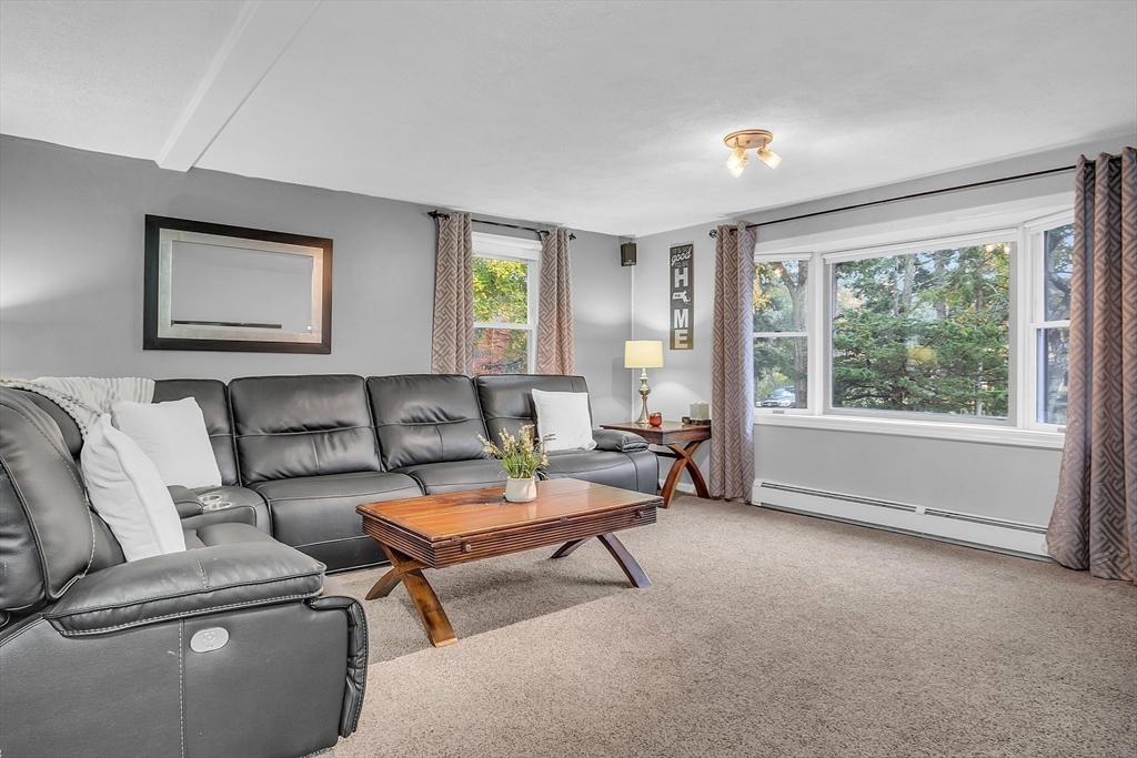 91 Chapin Road Hudson, MA 01749 - Photo 15 of 42 a living room with furniture and a large window