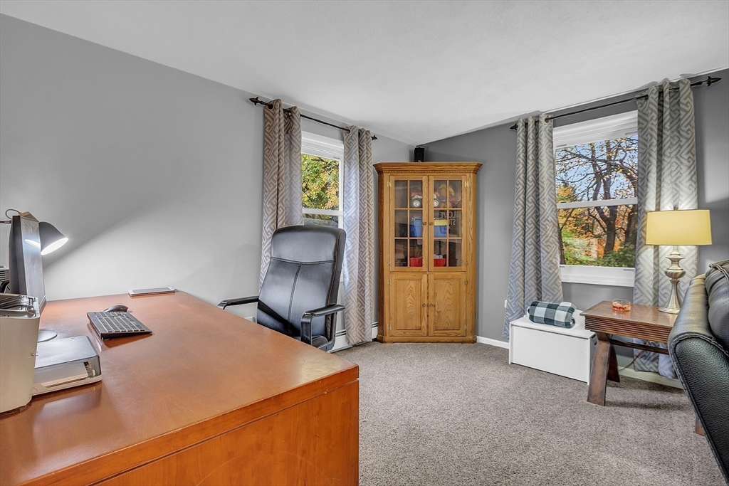 91 Chapin Road Hudson, MA 01749 - Photo 16 of 42 a living room with furniture and a window