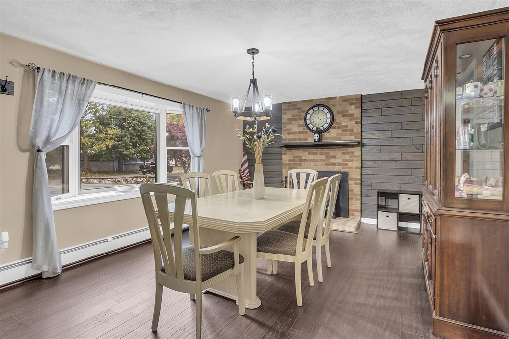 91 Chapin Road Hudson, MA 01749 - Photo 17 of 42 a view of a dining room with furniture window and wooden floor