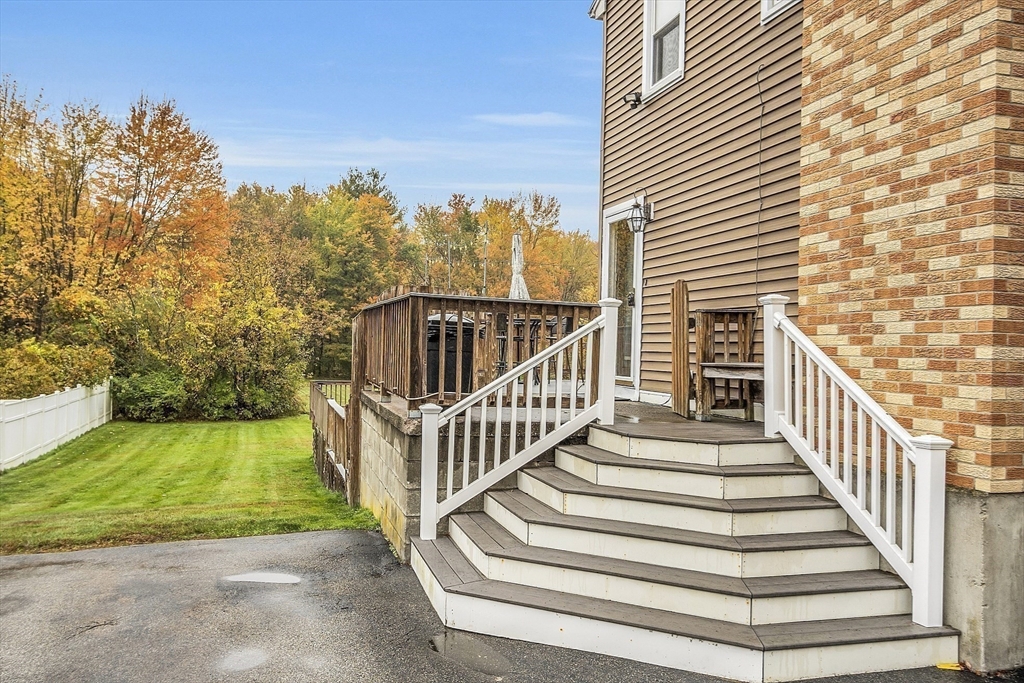 91 Chapin Road Hudson, MA 01749 - Photo 3 of 42 a view of a balcony with wooden floor and fence