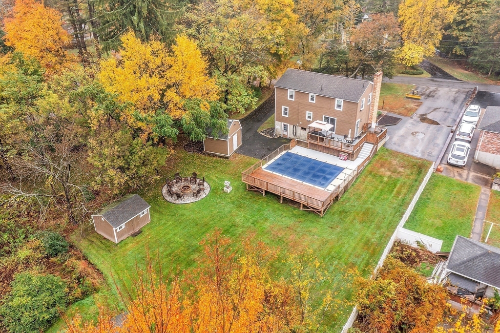 91 Chapin Road Hudson, MA 01749 - Photo 34 of 42 an aerial view of a house with garden space and swimming pool