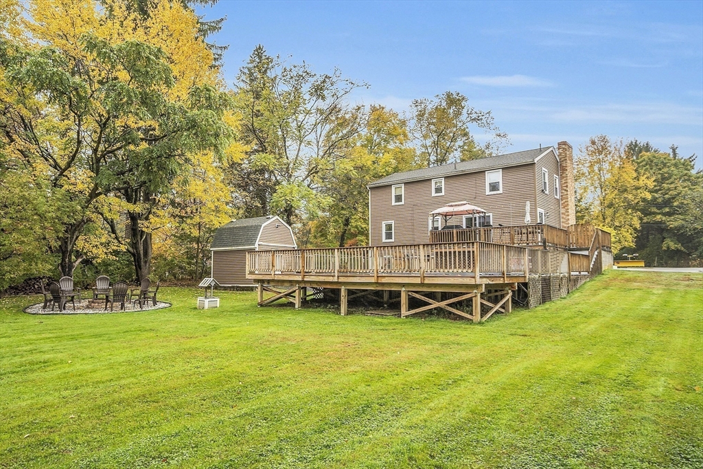 91 Chapin Road Hudson, MA 01749 - Photo 37 of 42 a view of a house with a big yard and large trees