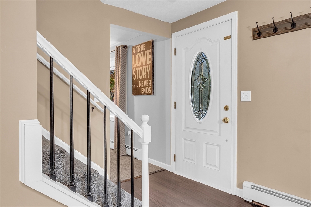 91 Chapin Road Hudson, MA 01749 - Photo 4 of 42 a view of a hallway with wooden floor and entryway