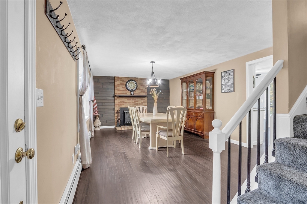 91 Chapin Road Hudson, MA 01749 - Photo 9 of 42 a dining room with furniture entryway and wooden floor