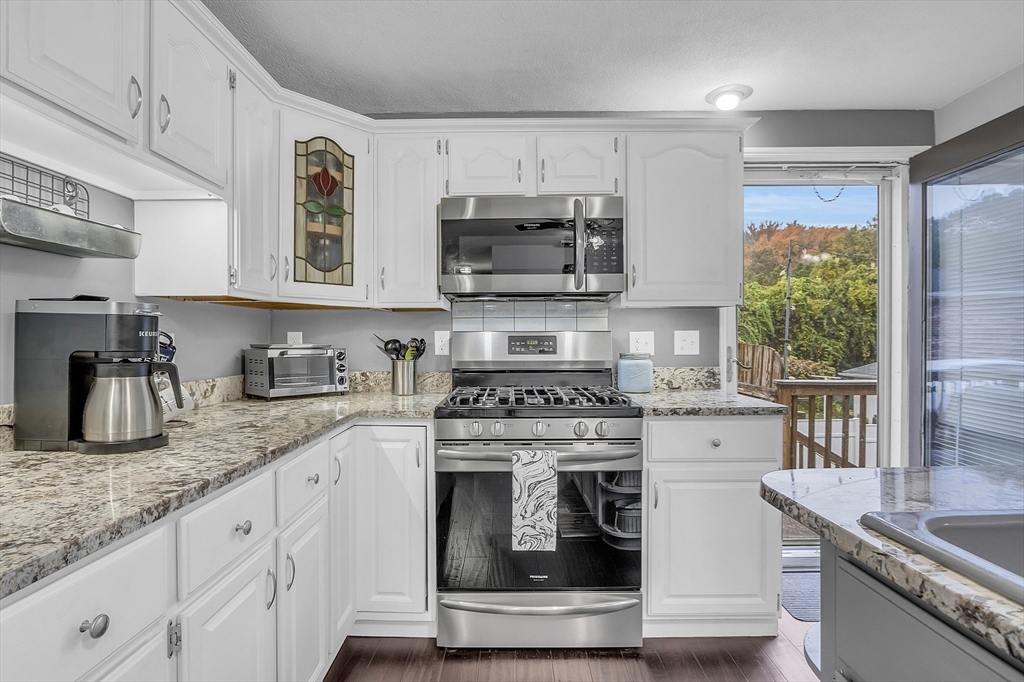 91 Chapin Road Hudson, MA 01749 - Photo 10 of 42 a kitchen with stainless steel appliances granite countertop a stove and a sink