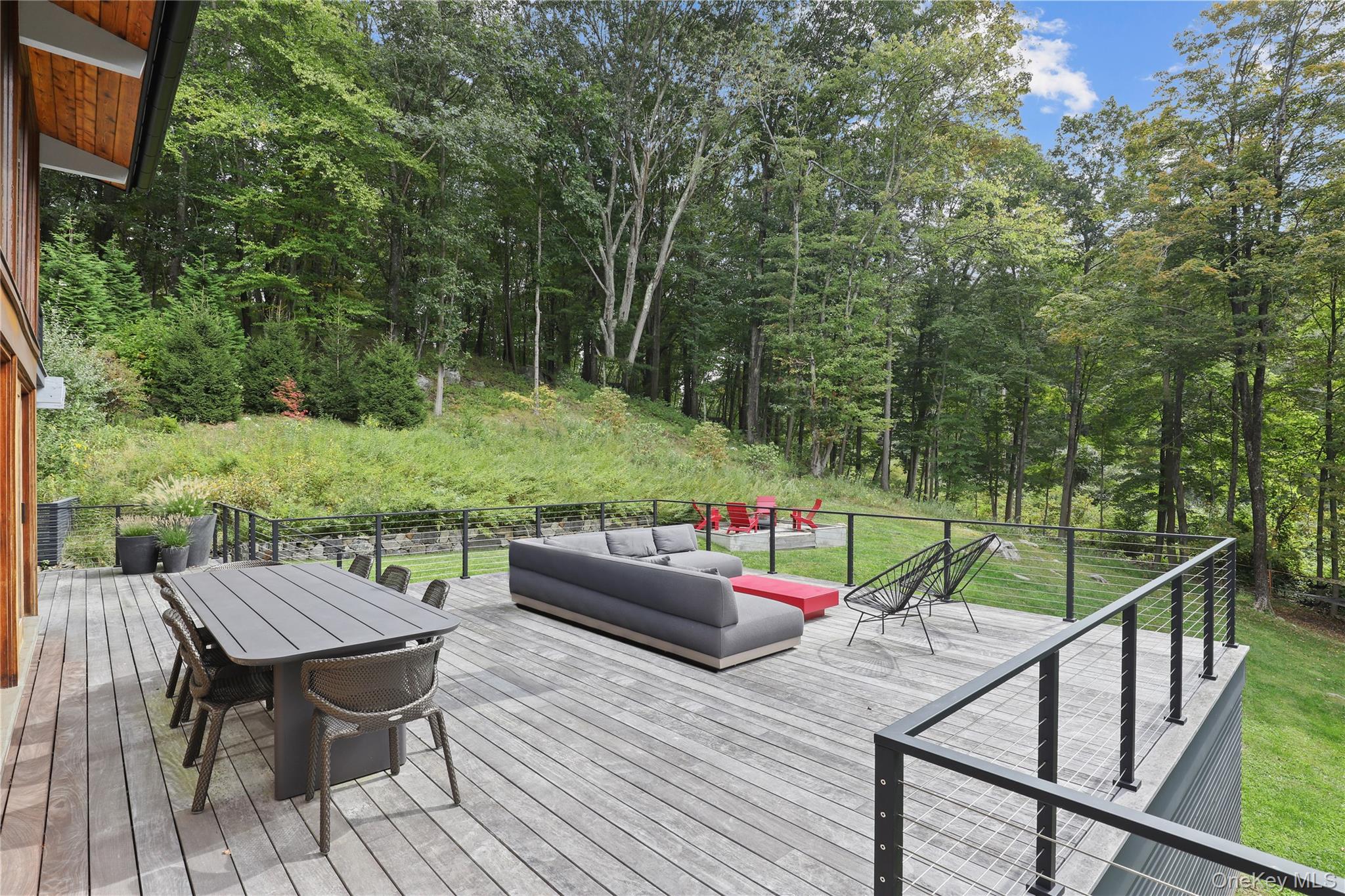 21 Black Spring Road Pound Ridge, NY 10576 - Photo 4 of 36 Brazilian hardwood deck with steps to the lawn
