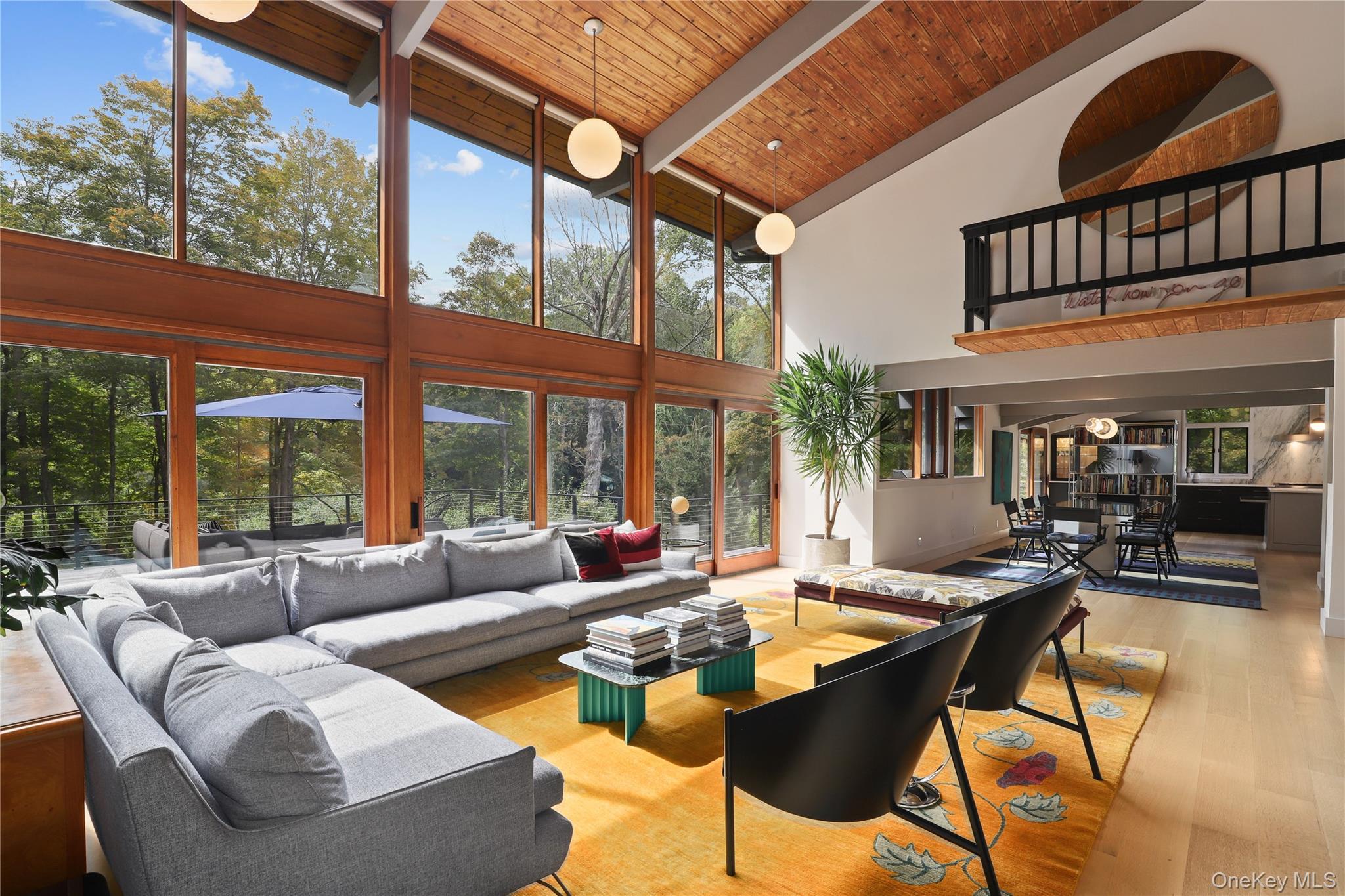 21 Black Spring Road Pound Ridge, NY 10576 - Photo 7 of 36 Living room with double-height floor to ceiling windows/doors out to the deck