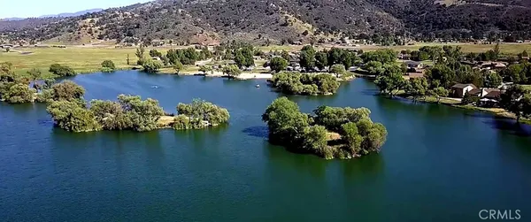an aerial view of a houses with ocean view