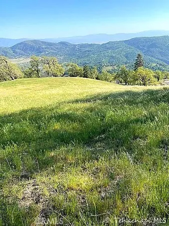 a view of an ocean and a mountain