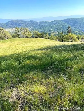 a view of an ocean and a mountain