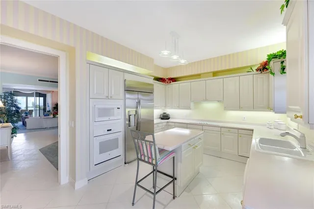 a dining room with furniture and chandelier