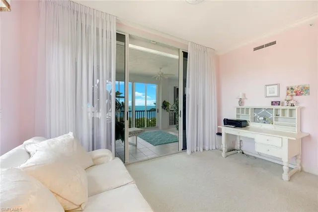a bathroom with a tub a sink and mirror