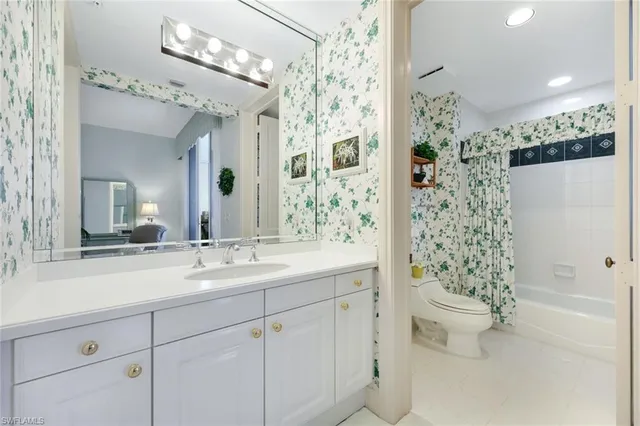 a living room with furniture fireplace and potted plants