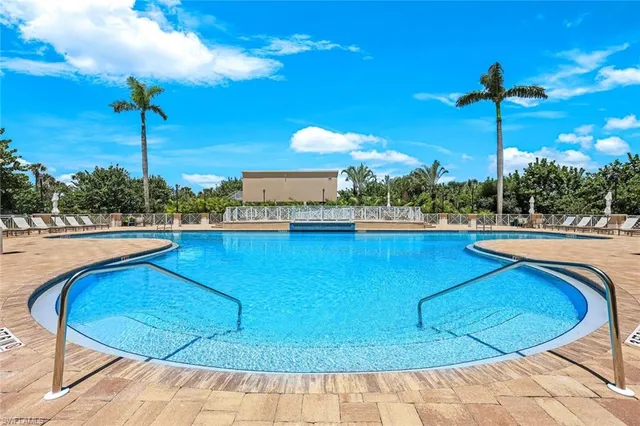a view of a swimming pool with a yard