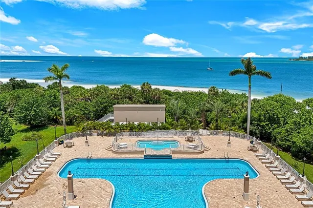 a view of a swimming pool with a table and chairs