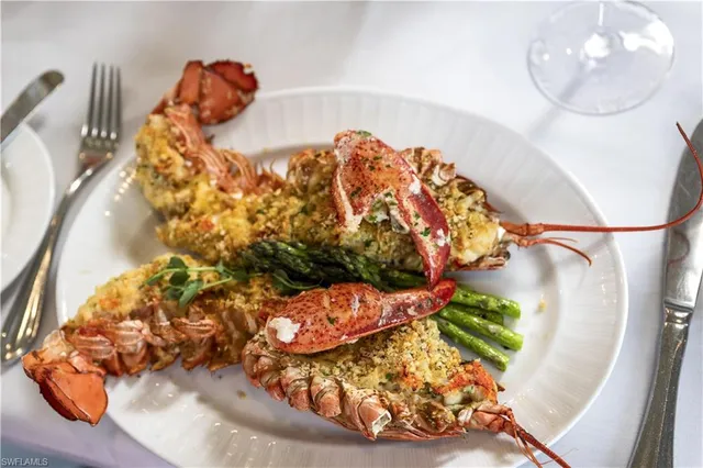 an aerial view of residential houses with outdoor space and swimming pool
