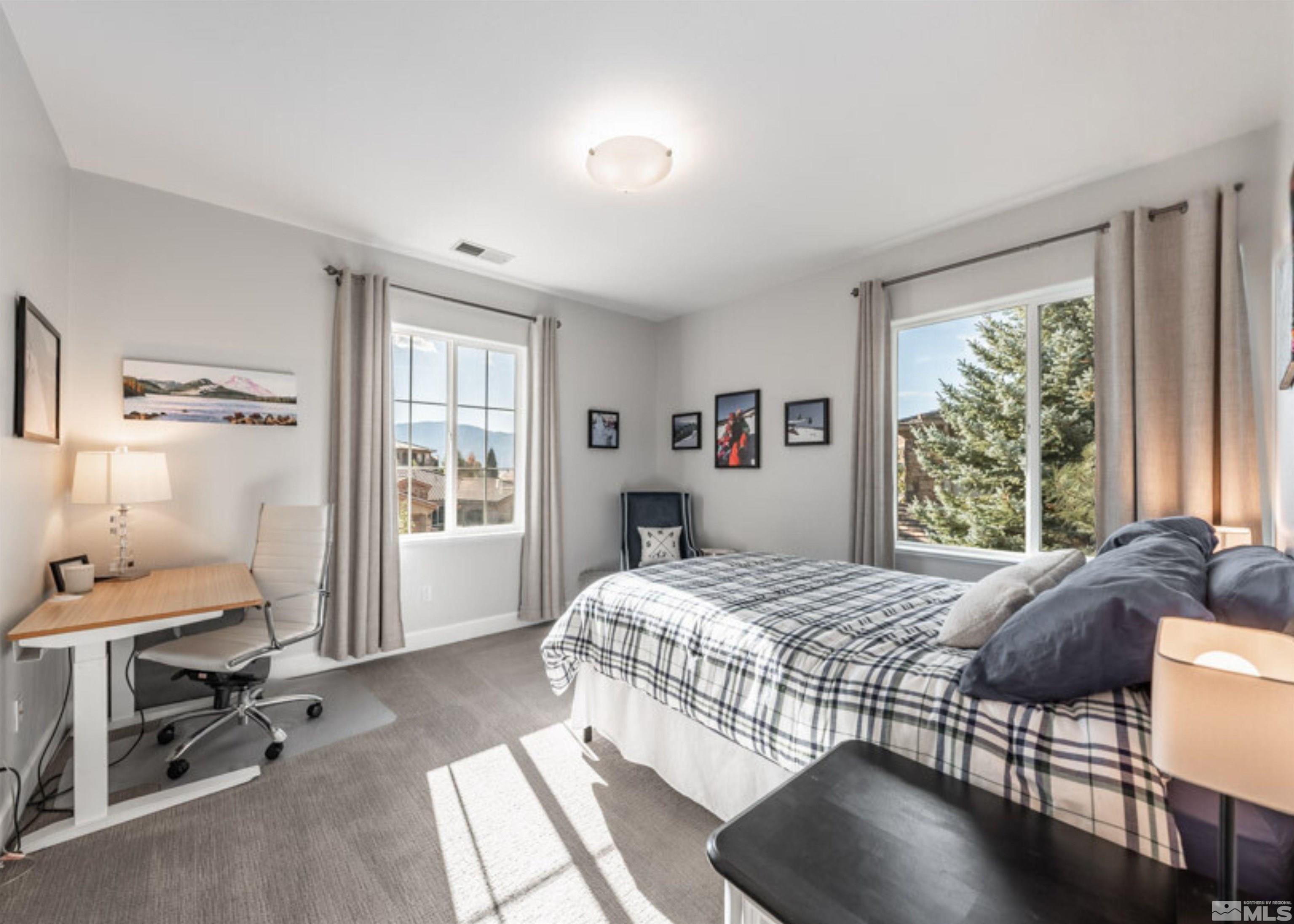 1880 Laurel Ridge Drive Reno, NV 89523 - Photo 23 of 40 a bedroom with a bed and a window