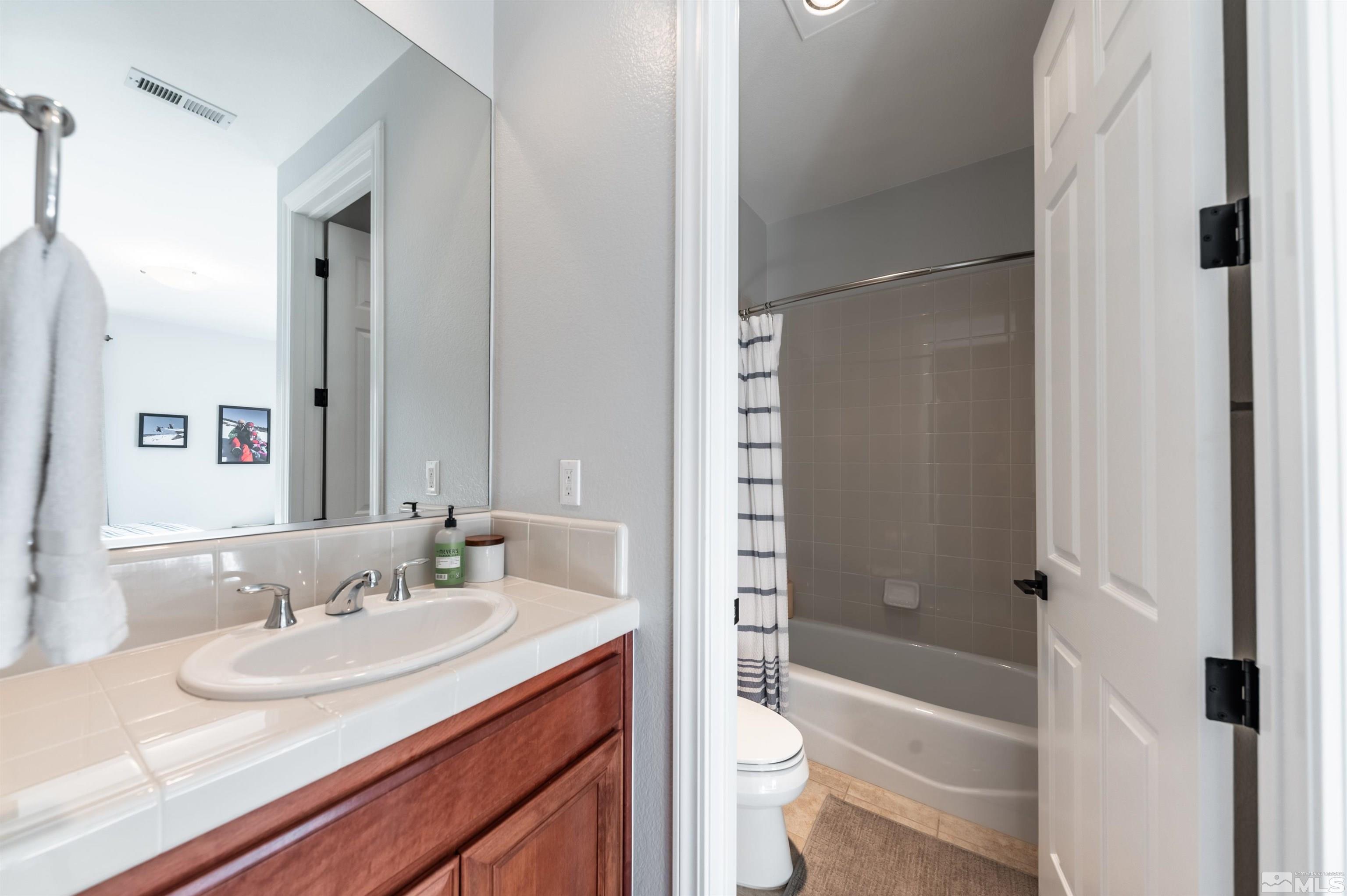 1880 Laurel Ridge Drive Reno, NV 89523 - Photo 24 of 40 a bathroom with a sink toilet tub vanity and shower