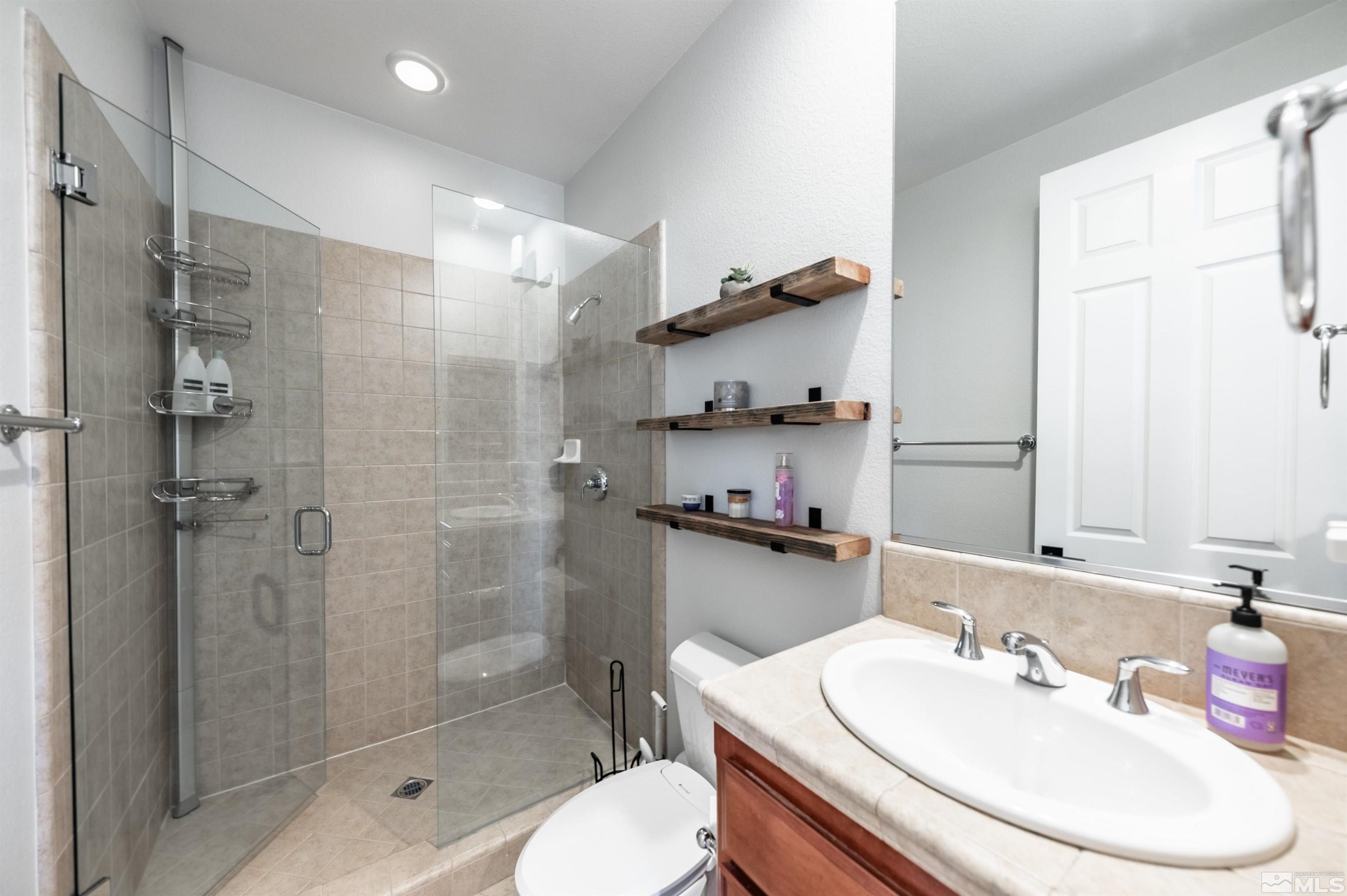 1880 Laurel Ridge Drive Reno, NV 89523 - Photo 30 of 40 a bathroom with a sink toilet and shower
