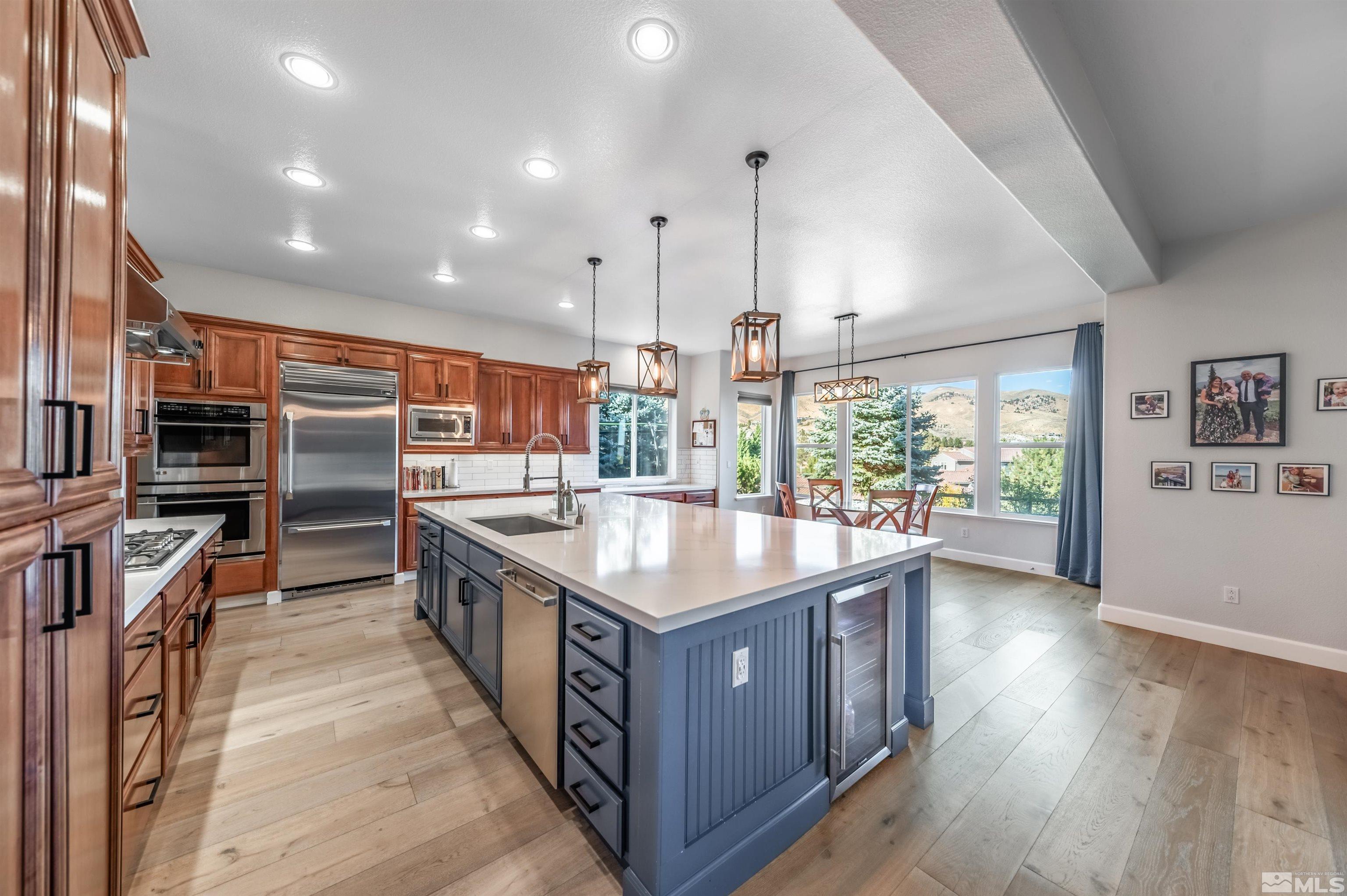 1880 Laurel Ridge Drive Reno, NV 89523 - Photo 8 of 40 a kitchen with stainless steel appliances granite countertop a large counter top and oven
