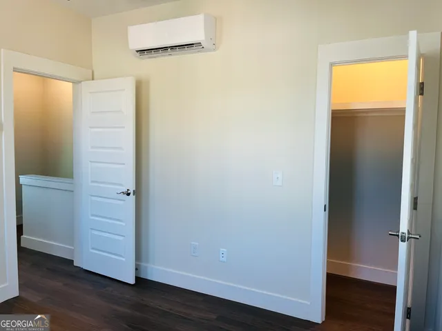 a view of front door with wooden floor