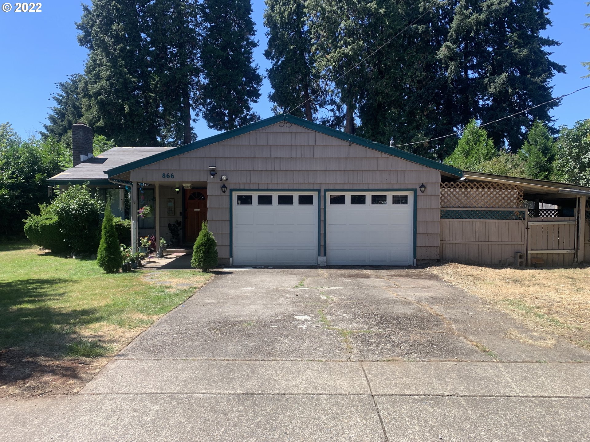 866 58th Street Springfield, OR 97478 - Photo 2 of 12 a front view of a house with a yard and garage