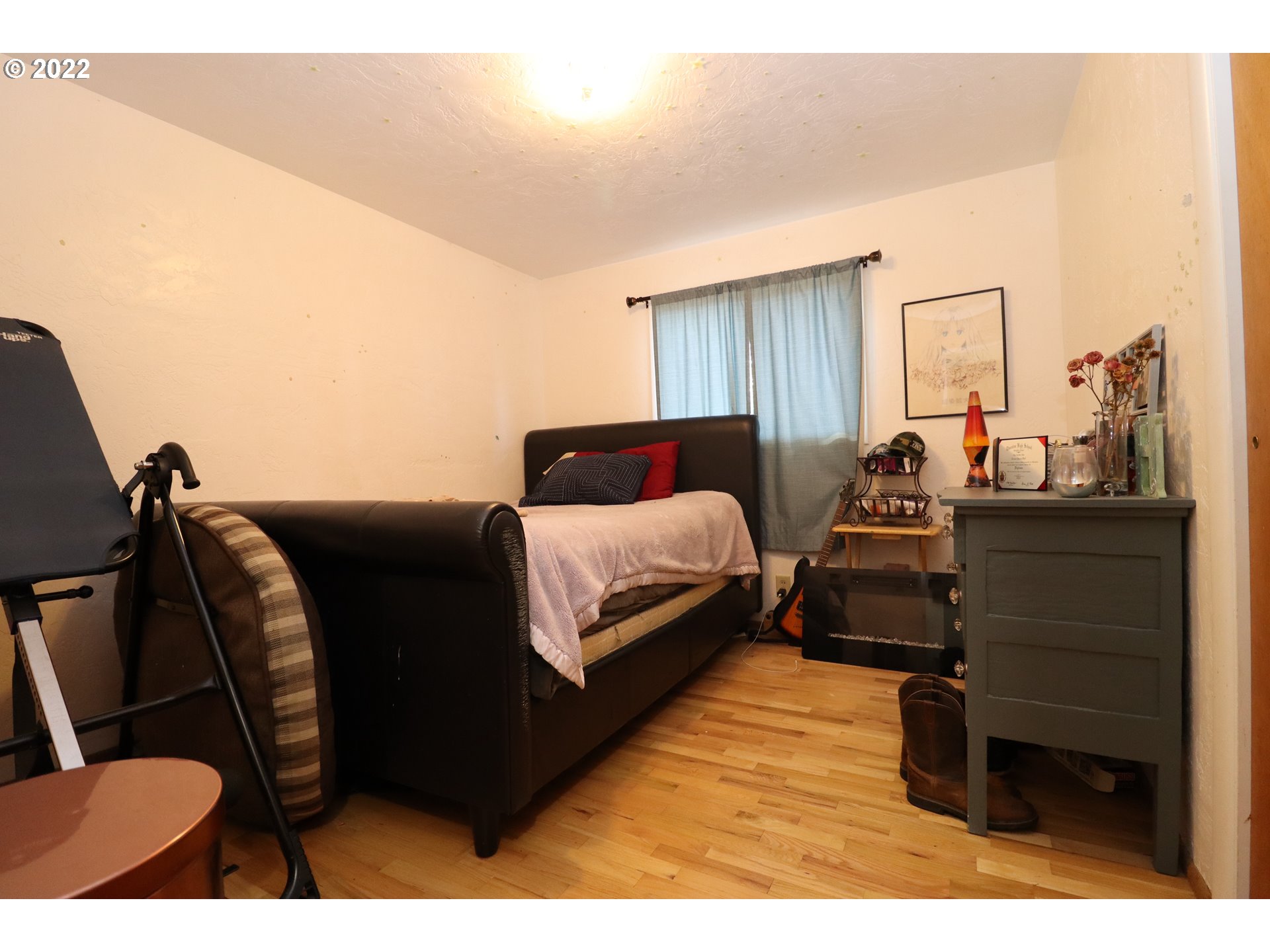 866 58th Street Springfield, OR 97478 - Photo 7 of 12 a bedroom with a bed window and dresser