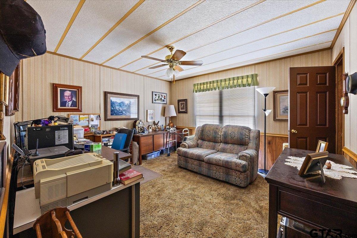 304 County Road 2206 Rusk, TX 75785 - Photo 23 of 27 a living room with furniture and a flat screen tv