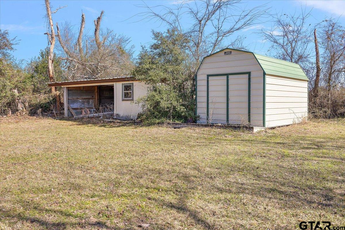 304 County Road 2206 Rusk, TX 75785 - Photo 7 of 27 a view of a house with backyard and tree