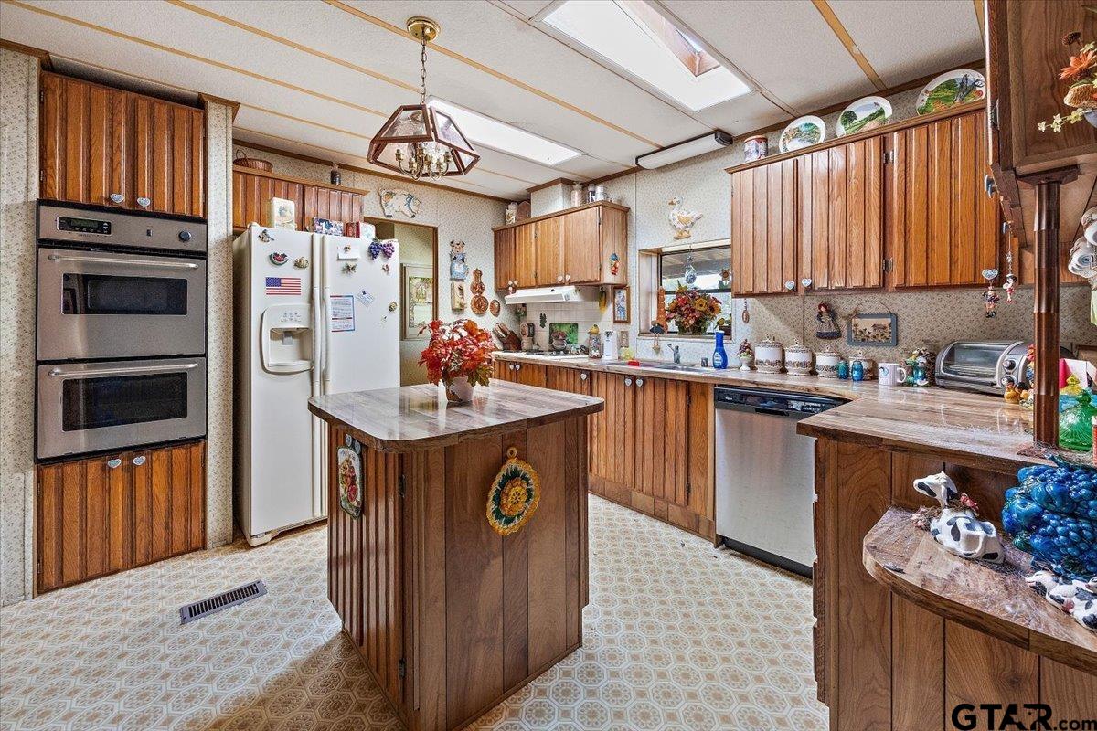 304 County Road 2206 Rusk, TX 75785 - Photo 10 of 27 a kitchen with a sink stove and cabinets