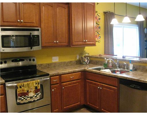 132 McCall Road Butler, PA 16001 - Photo 5 of 18 Kitchen. Kitchen has breakfast bar that opens to great room