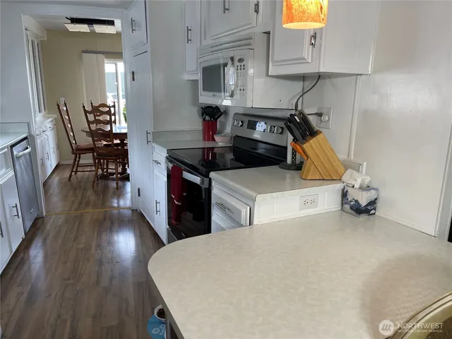 a view of kitchen and wooden floor