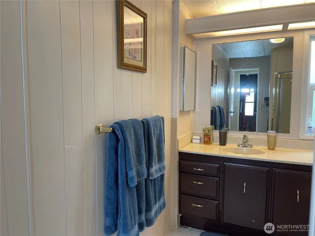 a bathroom with a double vanity sink and mirror