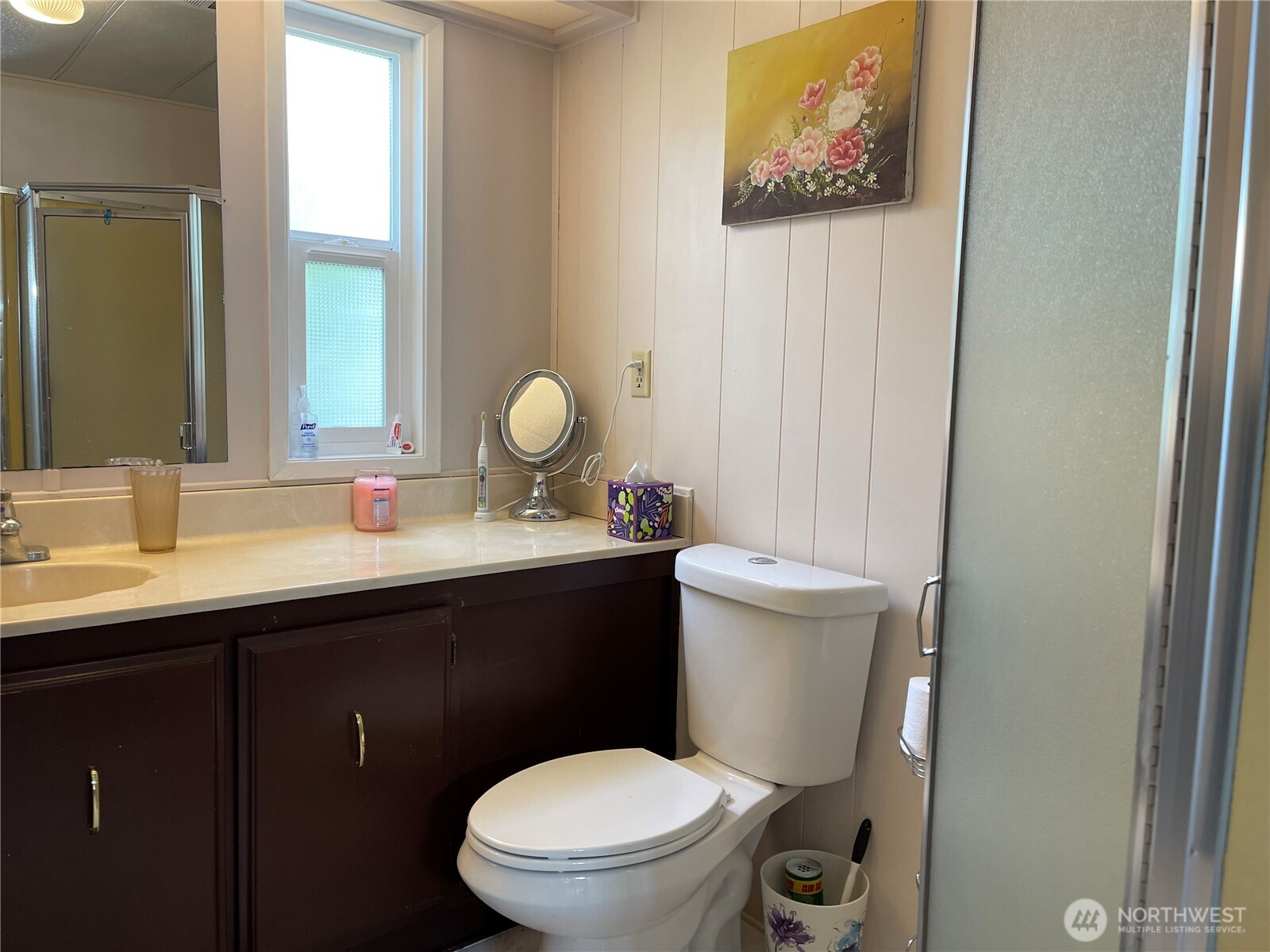 2101 South 324th Street, Unit 21 Federal Way, WA 98003 - Photo 20 of 40 a bathroom with a toilet a sink and a mirror