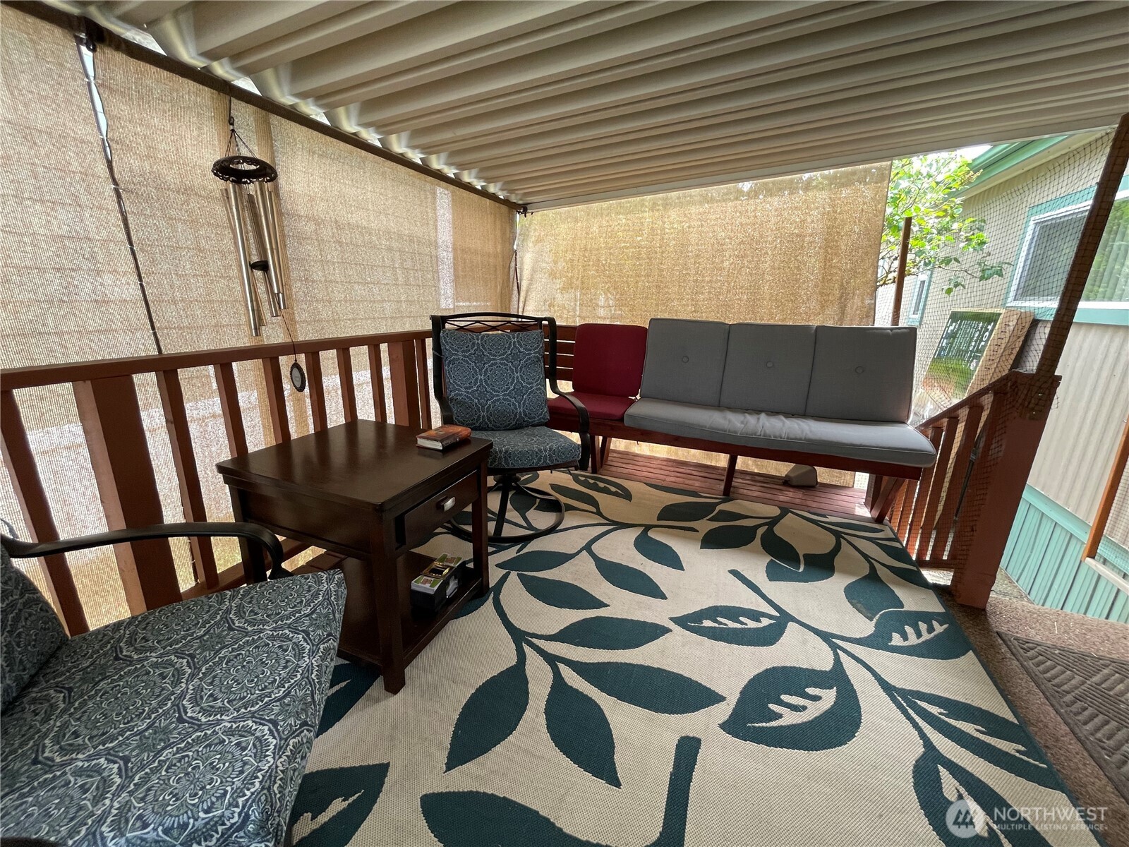2101 South 324th Street, Unit 21 Federal Way, WA 98003 - Photo 22 of 39 a balcony with furniture and wooden floor
