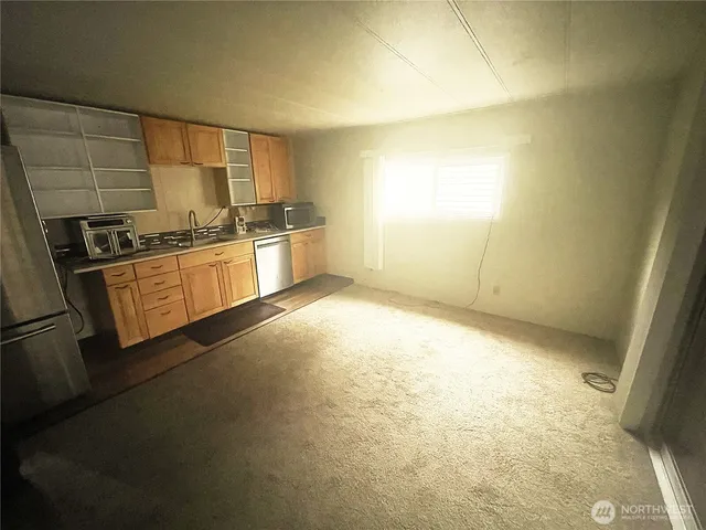 a large kitchen with a stove