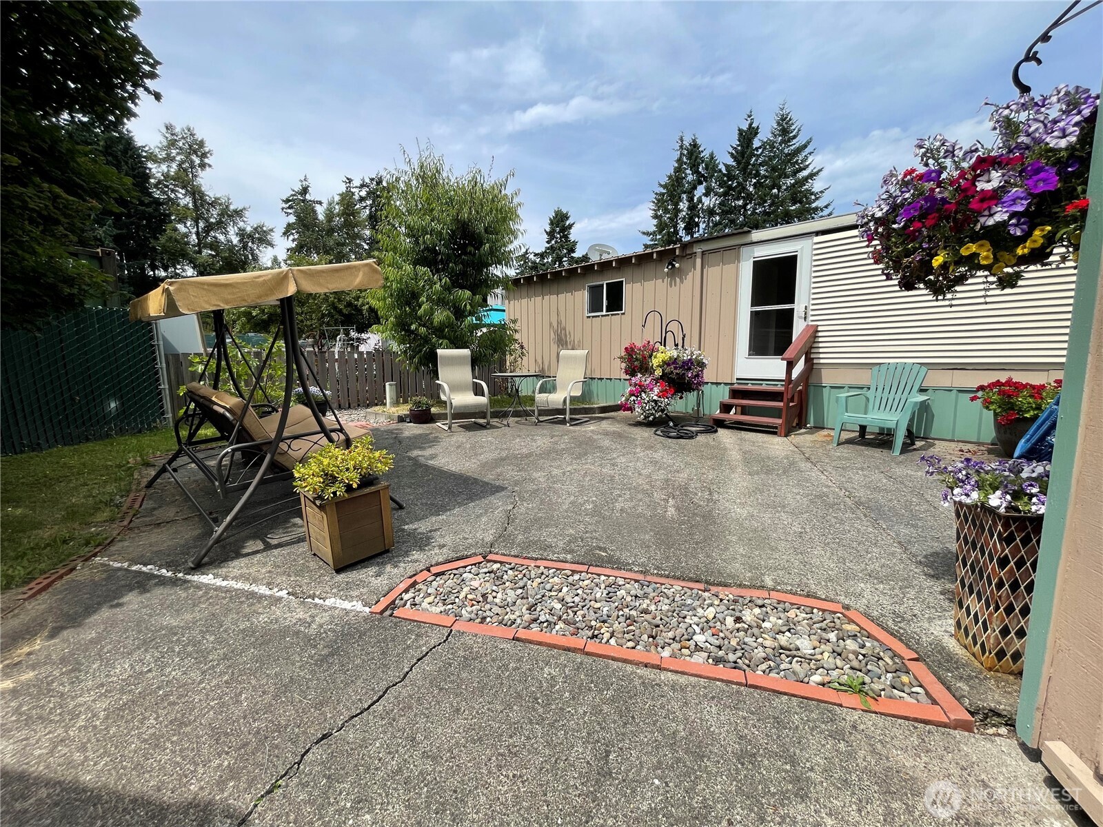 2101 South 324th Street, Unit 21 Federal Way, WA 98003 - Photo 38 of 39 a view of a backyard with sitting area and furniture