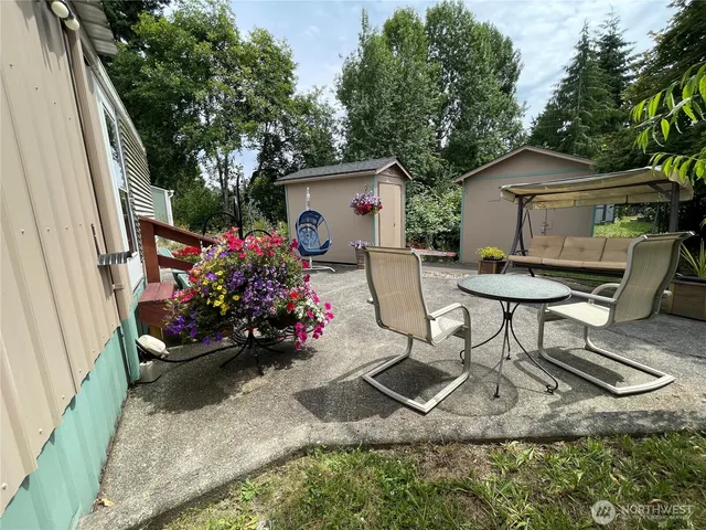 a front view of a house with a yard and a fountain