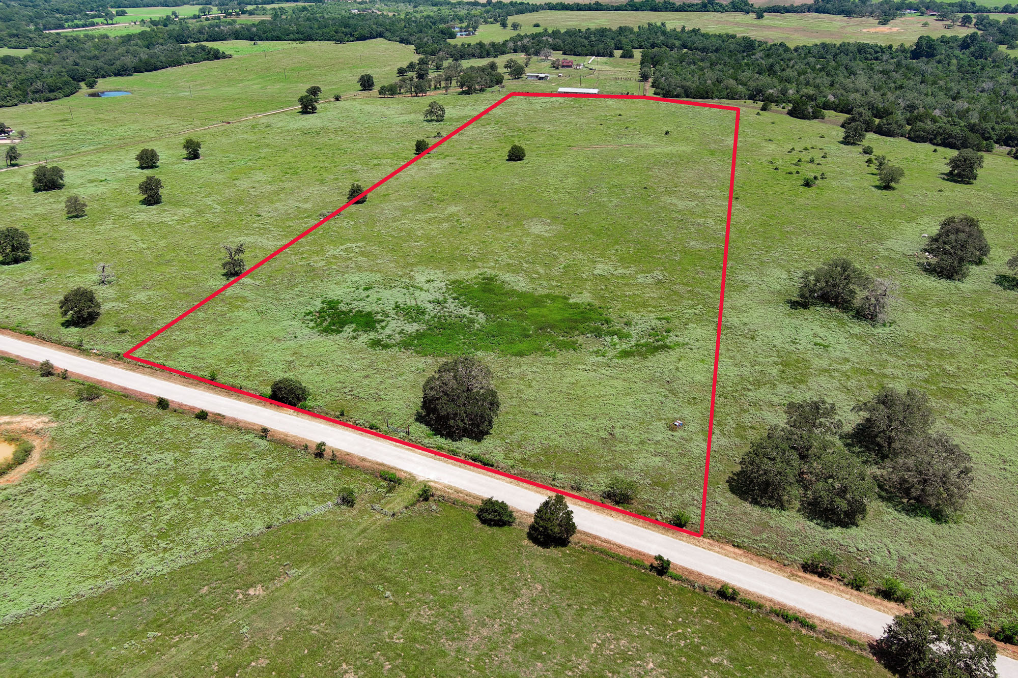 Tbd Hofferek Road Rosanky, TX 78953 - Photo 1 of 32 A spacious, verdant lot awaits your vision, bordered by a tranquil road and surrounded by nature's beauty.