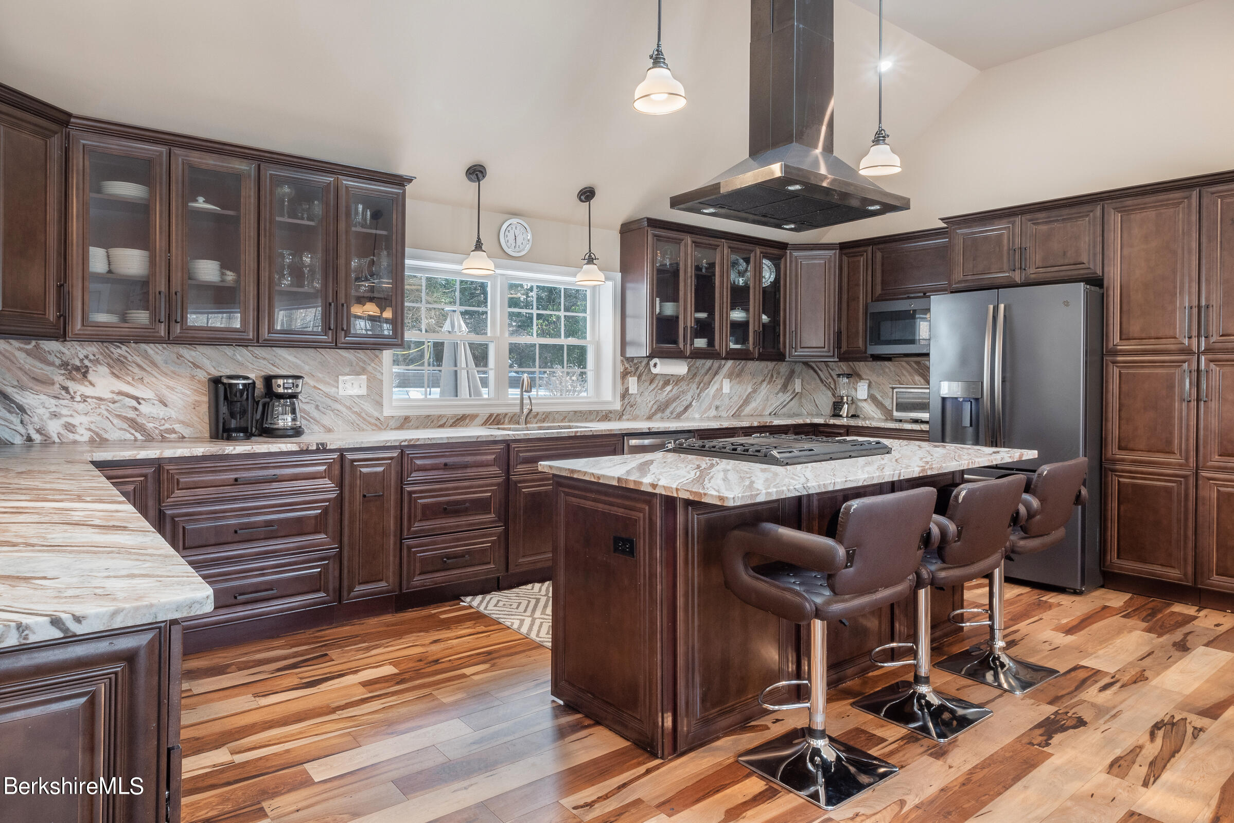 7 Hawthorne Road Stockbridge, MA 01262 - Photo 15 of 41 a kitchen with stainless steel appliances granite countertop a stove a refrigerator and a wooden cabinets