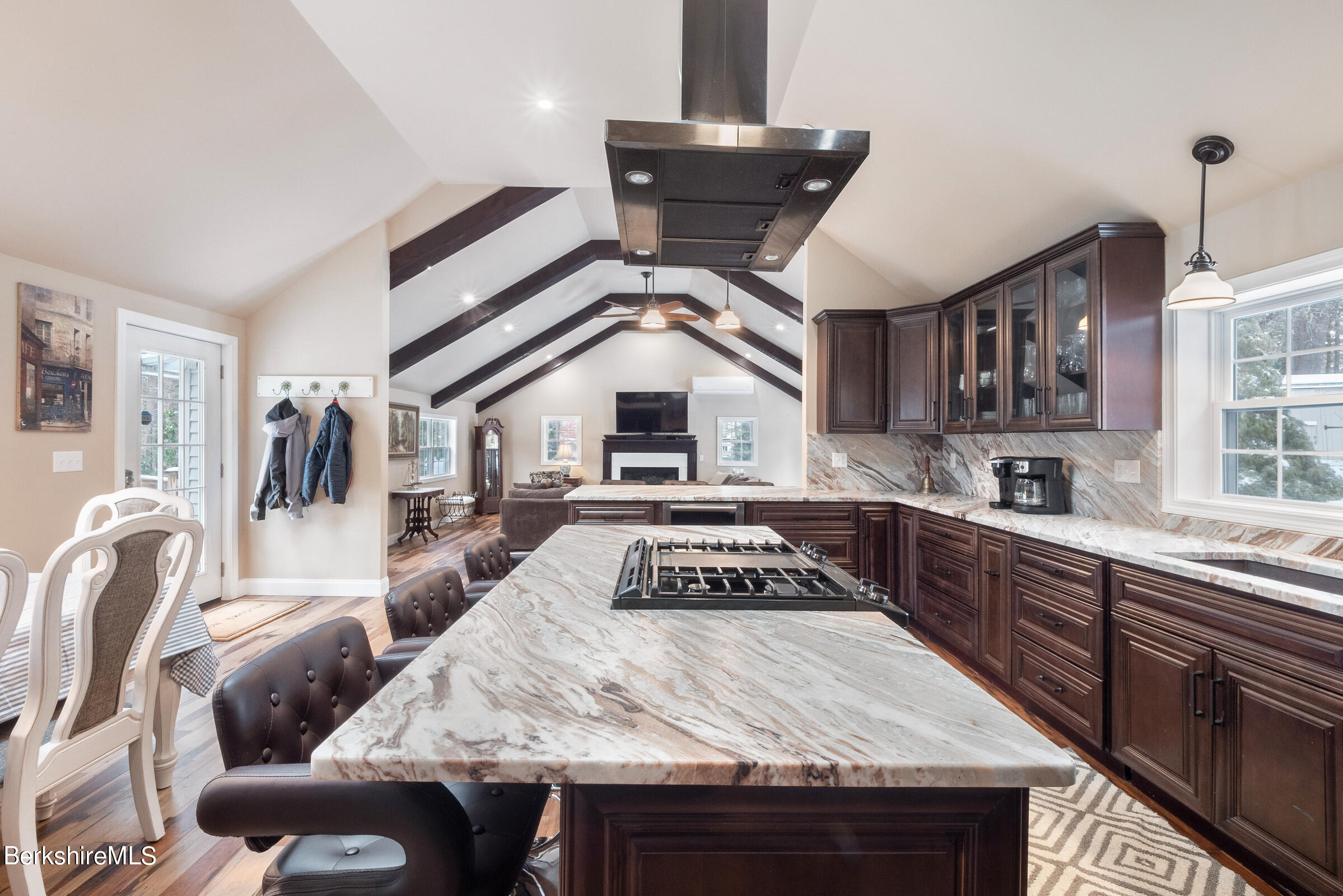 7 Hawthorne Road Stockbridge, MA 01262 - Photo 17 of 41 a kitchen with stainless steel appliances granite countertop a stove a sink dishwasher and cabinets with wooden floor